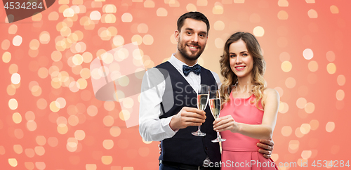 Image of happy couple with champagne glasses toasting