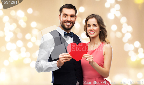 Image of happy couple with red heart on valentines day