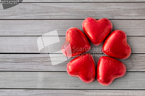 Image of close up of red heart shaped chocolate candies