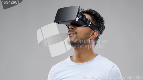 Image of man in virtual reality headset or vr glasses