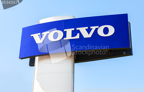 Image of Volvo dealership sign against the blue sky