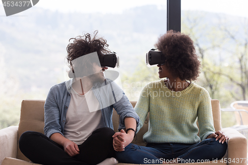 Image of Multiethnic Couple using virtual reality headset