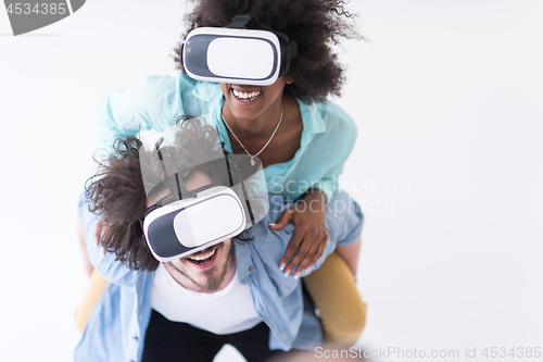 Image of multiethnic couple getting experience using VR headset glasses