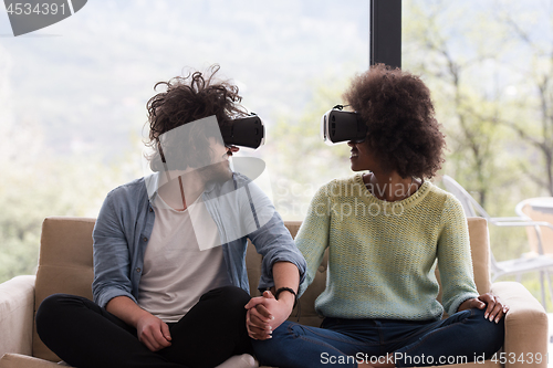 Image of Multiethnic Couple using virtual reality headset