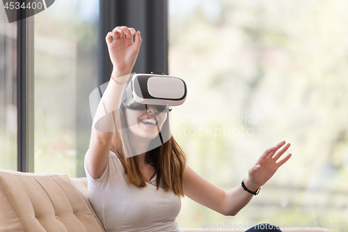 Image of woman using VR-headset glasses of virtual reality