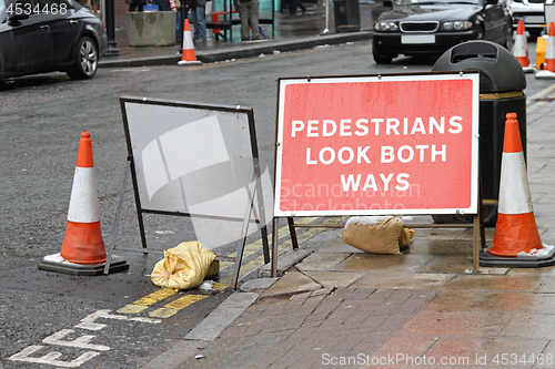 Image of Pedestrians Look Sign