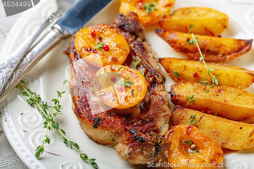 Image of Pork entrecote with apricots, thyme and potatoes.