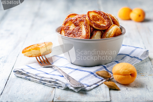 Image of Homemade pancakes in a clay bowl.