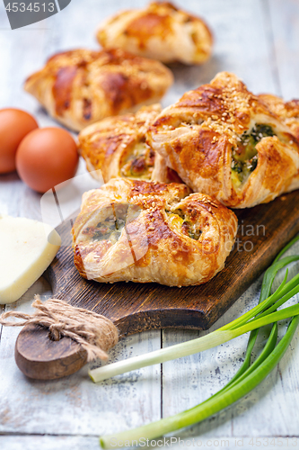 Image of Homemade puffs with spinach, egg and green onions.