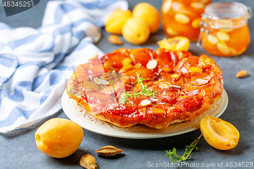 Image of Apricot tarte tatin pie with thyme and almonds.