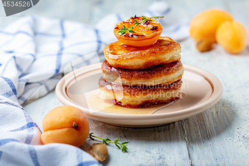 Image of Fritters with apricot jam and thyme for breakfast.