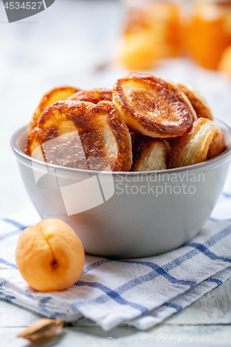 Image of Sourdough pancakes in a ceramic bowl.