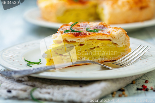 Image of Piece of French puff pastry with potatoes.