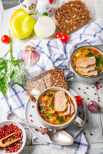 Image of Meat soup with fresh cabbage and vegetables.