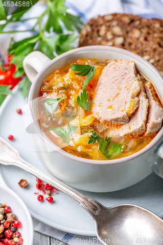 Image of Traditional soup with fresh cabbage and meat. 