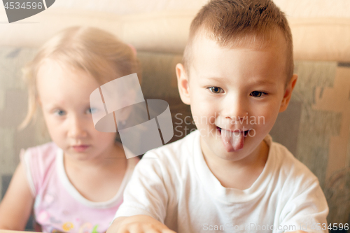 Image of Boy and Girl Watching TV