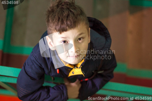 Image of Boy with cute eyes looking at camera