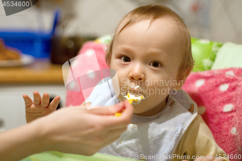 Image of Mother Feeding Small Baby