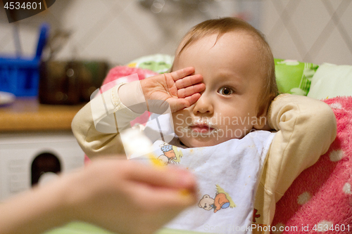 Image of Mother Feeding Small Baby