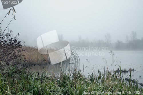 Image of Foggy landscape with river