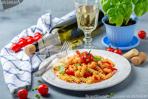 Image of Pasta with tomato sauce and shrimp.
