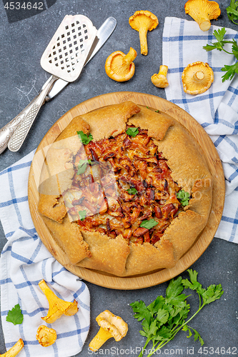 Image of Open pie (Galette) with wild chanterelles.