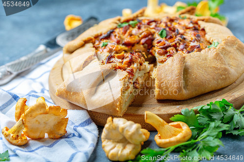 Image of Sliced pie (Galette) with wild chanterelles.