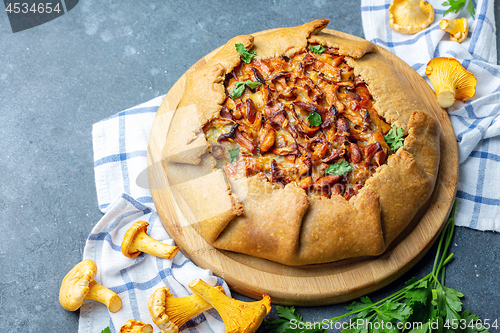 Image of Homemade pie with wild chanterelles and potatoes.