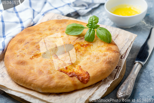 Image of Traditional Georgian closed pie with cheese.