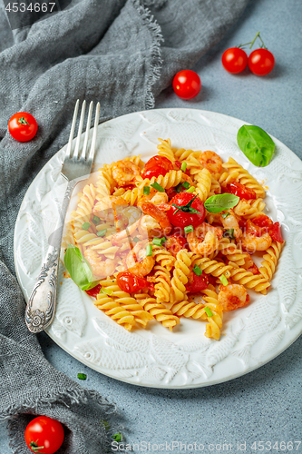 Image of Tomato pasta fusilli with prawns.