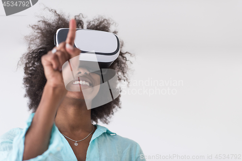 Image of black girl using VR headset glasses of virtual reality