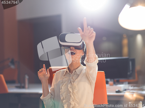 Image of businesswoman using VR-headset glasses of virtual reality