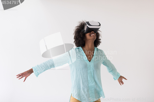 Image of black girl using VR headset glasses of virtual reality