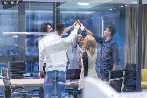 Image of startup Group of young business people celebrating success