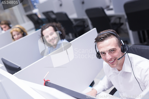 Image of male call centre operator doing his job