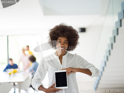 Image of Portrait of  black casual businesswoman using tablet  with cowor