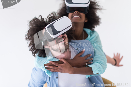 Image of multiethnic couple getting experience using VR headset glasses