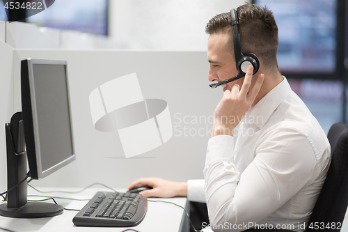 Image of male call centre operator doing his job