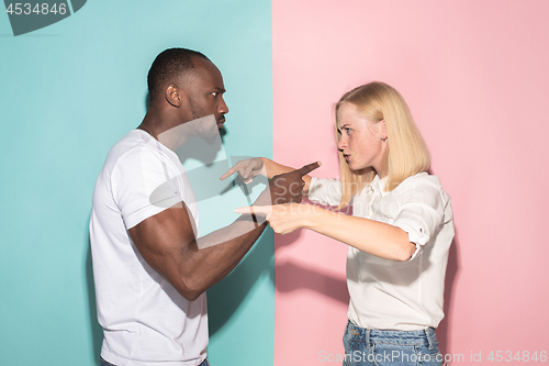 Image of Man and woman posing at studio during quarrel