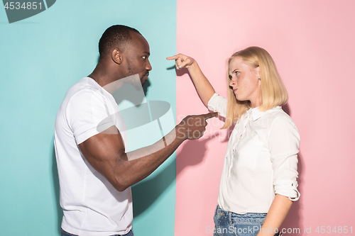 Image of Man and woman posing at studio during quarrel