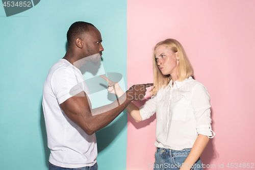 Image of Man and woman posing at studio during quarrel