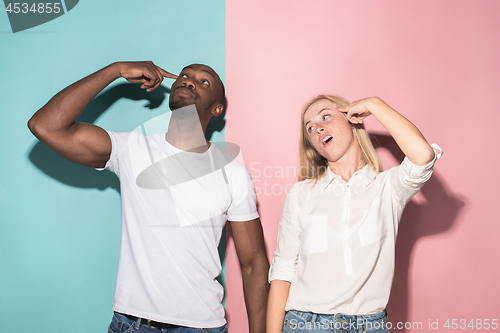 Image of Man and woman posing at studio during quarrel