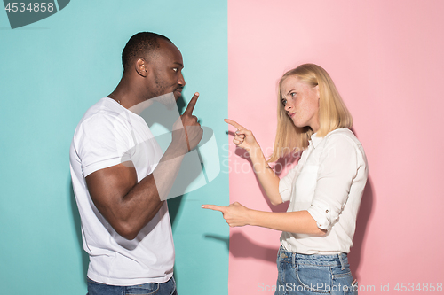 Image of Man and woman posing at studio during quarrel