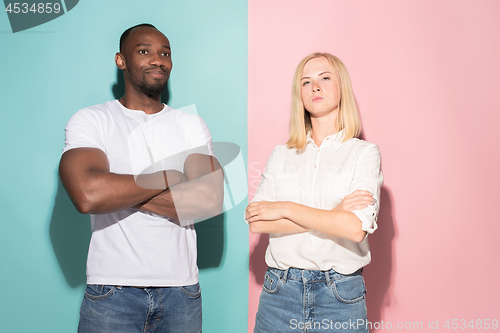 Image of Young serious thoughtful businessman and woman. Doubt concept.