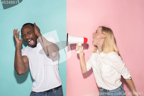 Image of Man and woman posing at studio during quarrel