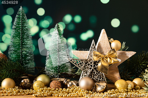 Image of Christmas decoration wooden star with fir trees