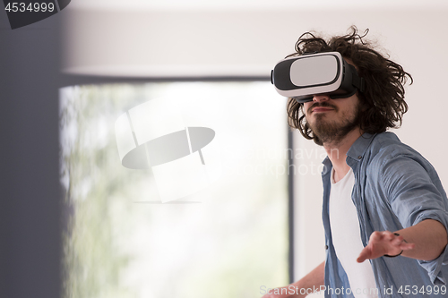 Image of man using VR-headset glasses of virtual reality