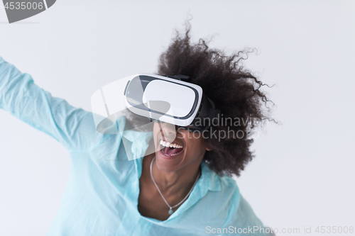 Image of black girl using VR headset glasses of virtual reality