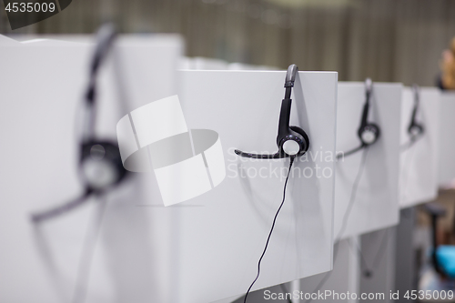 Image of Headphones in empty call center office