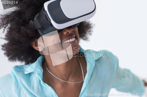 Image of black girl using VR headset glasses of virtual reality